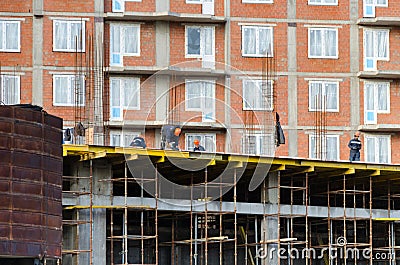 St.Petersburg. Russia -October 23,2018 : Workers are building a multi-storey house Editorial Stock Photo