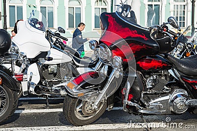 ST PETERSBURG, RUSSIA-September 26, 2020: Red Harley-Davidson motorcycle with good looking batwing with fire aerography. Bike is Editorial Stock Photo