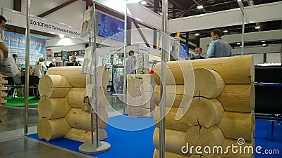 Trade show expo background. Wooden House Exhibition. Fair Suburban Real Estate. Fairground. Stand with logs. Green housing concept Editorial Stock Photo