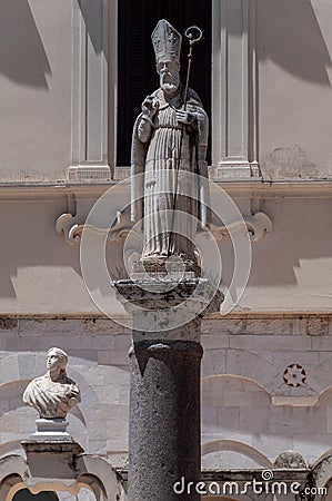 Italy. Bari. San Sabino. 17th century statue on granite column in the courtyard of the Archbishop's Palace Editorial Stock Photo