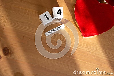 St. Valentine February 14 calendar of wooden cubes from the eternal calendar. Wooden background Stock Photo