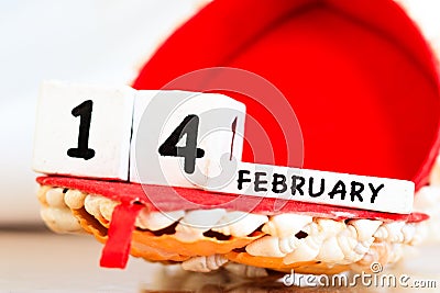 St. Valentine February 14 calendar of wooden cubes from the eternal calendar. Wooden background Stock Photo