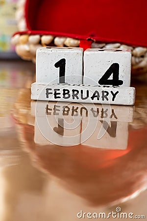 St. Valentine February 14 calendar of wooden cubes from the eternal calendar. Wooden background Stock Photo