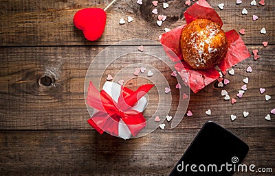 St. Valentine`s Day. Coffee, smartphone cake with cream and suga Stock Photo