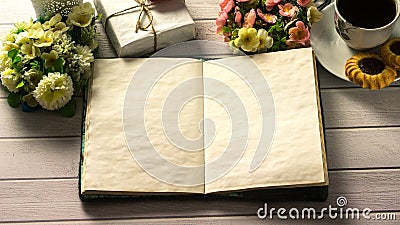 St. Valentine`s day. Cup of coffee with empty love letter on white wooden table Stock Photo