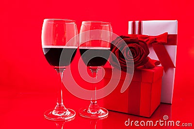 St Valentine`s setting with present and red wine Stock Photo