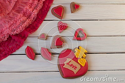 St. Valentines composition. Top view on red honey cakes on wooden table Stock Photo