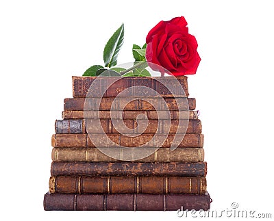 Stack of antique books and red rose Stock Photo