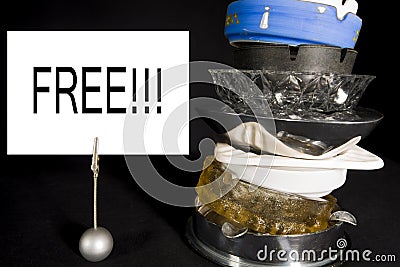 Stack of Ashtrays with 'Free' Sign Stock Photo