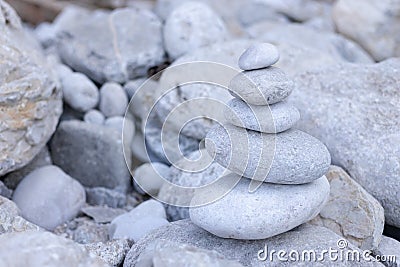 Stack balancing pebble stones pool with out Stock Photo