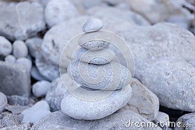 Stack balancing pebble stones pool with out Stock Photo