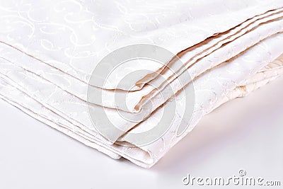 Stack of bed natural linen clothing. Stock Photo