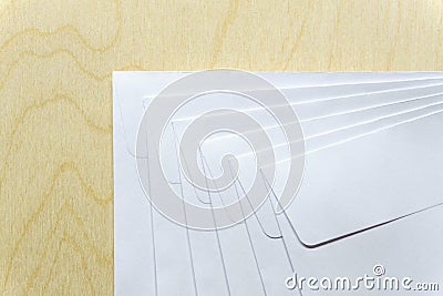 Blank white envelopes on wooden desk Stock Photo