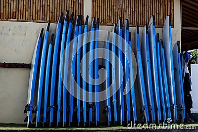 Stack of blue color soft surfboards Stock Photo
