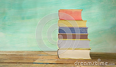 Stack of books against grungy background, Stock Photo