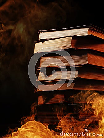 Stack of books in a burning fire Stock Photo