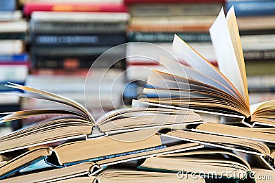 A stack of books with colorful covers. The library or bookstore. Books or textbooks. Education and reading Stock Photo