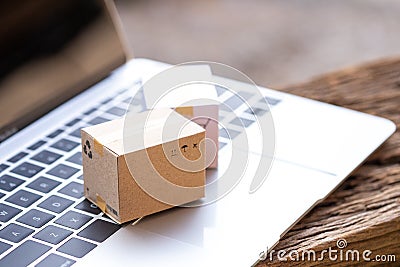 Stack boxes on laptop Idea of shopping online and service Stock Photo