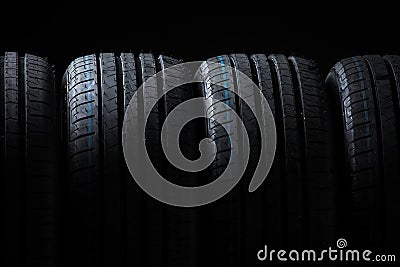 Stack of brand new high performance car tires Stock Photo