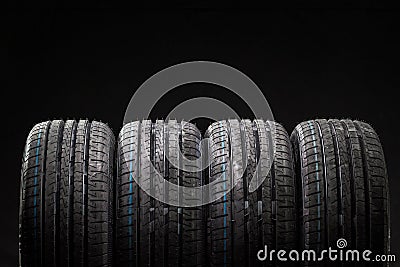 Stack of brand new high performance car tires Stock Photo