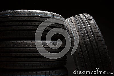 Stack of brand new high performance car tires Stock Photo