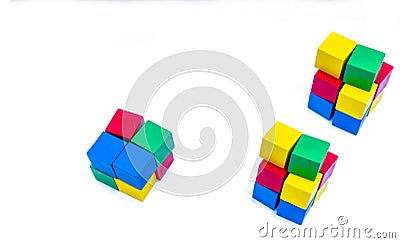 Stack of bright color wooden building block isolated on white background. Blue, red, green, and yellow cube blocks. Kids, baby toy Stock Photo