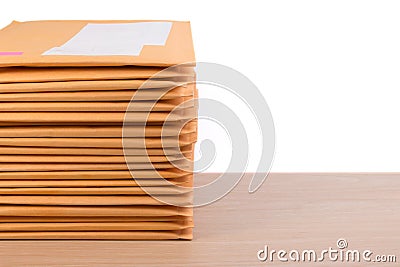 Stack of bubble wrap padded mailing envelopes and pen on white b Stock Photo