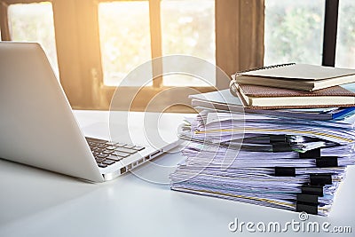 Stack of business report paper file on modern white office desk Stock Photo