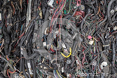 Stack of car wire, plastic cover, plastic connector and copper for recycling. Scrap car parts Stock Photo