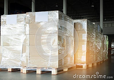 Stack cardboard boxes wrapping plastic on pallets for export shipment Stock Photo