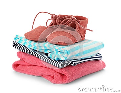 Stack of child clothes and cute shoes isolated Stock Photo