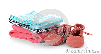 Stack of child clothes and cute shoes isolated Stock Photo