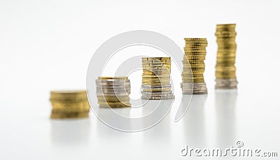 Stack of coins, five of rows isolated on white background. Growing and saving money concept. Stock Photo