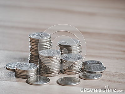 Stack of coins money on table for plan saving finance and banking business concept background. Stock Photo