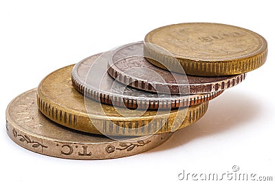 A stack of 5 coins of varying denomination and from varying countries. Stock Photo