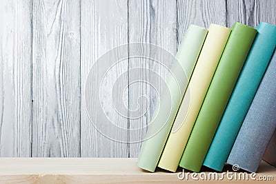 Stack of colorful books on wooden table. Back to school. Copy space Stock Photo