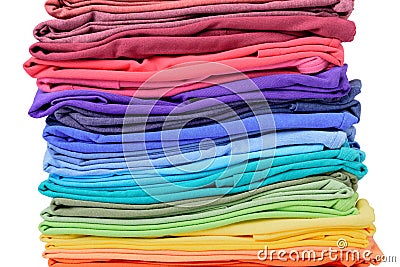 Stack of colorful t-shirt texture, isolated on white background. File contains a path to isolation. Stock Photo