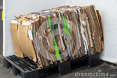 A stack of compacted cardboard ready to be recycled Stock Photo