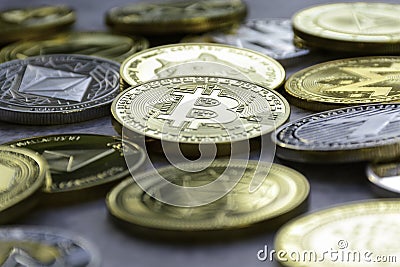 Stack of cryptocurrencies together. Golden bitcoin in the middle Stock Photo