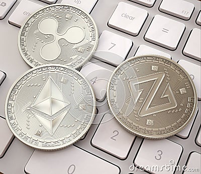 Stack of cryptocurrencies on white keyboard, Platinum physical coins, mining cryptocurrency Stock Photo