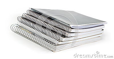 Stack of the different exercise books with wire spiral binding Stock Photo