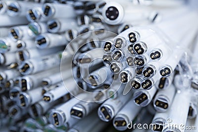 Stack of disused neon lamp tubes Stock Photo