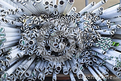 Stack of disused neon lamp tubes Stock Photo