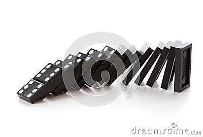 Stack of dominoes falling Stock Photo