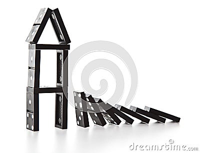 Stack of dominoes falling Stock Photo