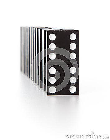 Stack of dominoes falling Stock Photo