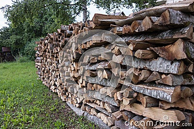 Stack of dried firewood of birch wood Stock Photo