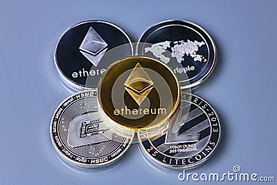 Stack of ether coins or ethereum on gold background Editorial Stock Photo