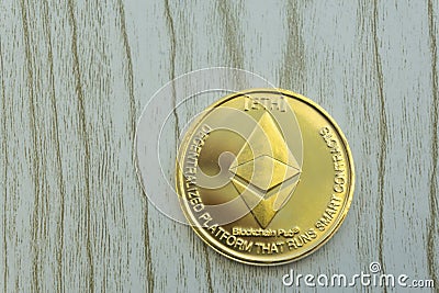 Stack of ether coins or ethereum on gold background to illustrate blockchain and cyber currency . Editorial Stock Photo