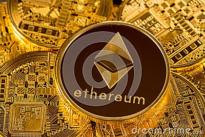 Stack of Ether coins with gold background Editorial Stock Photo